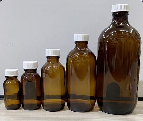 Empty glass screw-cap bottle